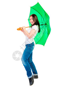 带着绿伞手杖的快乐年轻女子图片