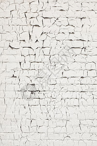 旧的和陈白色洗砖墙裂缝的抽象模式图片