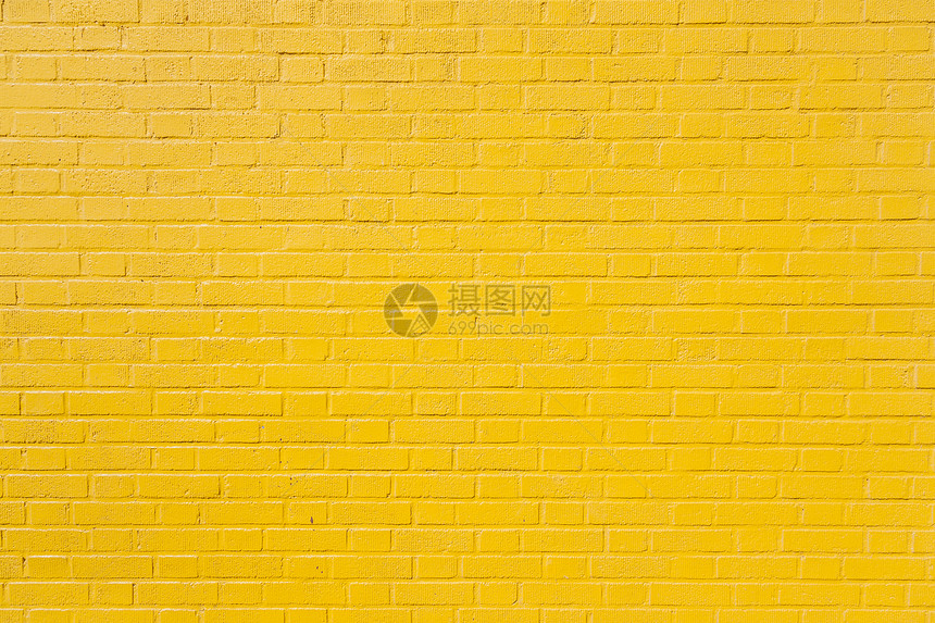 亮黄色油漆砖墙水平部分图片