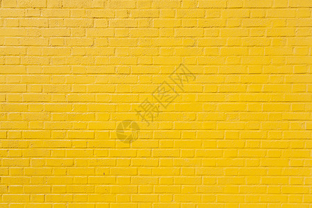 亮黄色油漆砖墙水平部分高清图片