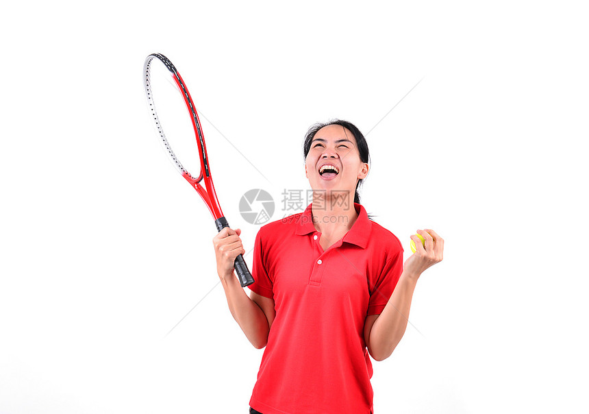 年轻的女性开心的打着网球
图片