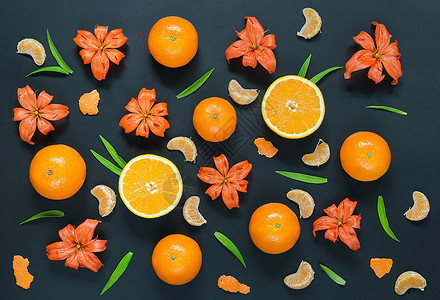 黑色背景的百合花橙子和普通话图片