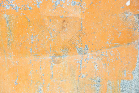 橙色背景含薄膜涂料和折合纹理的金属表面图片
