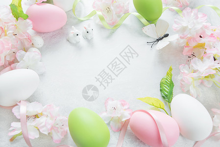 樱花丝带含蝴蝶樱花和鸡蛋的背景背景