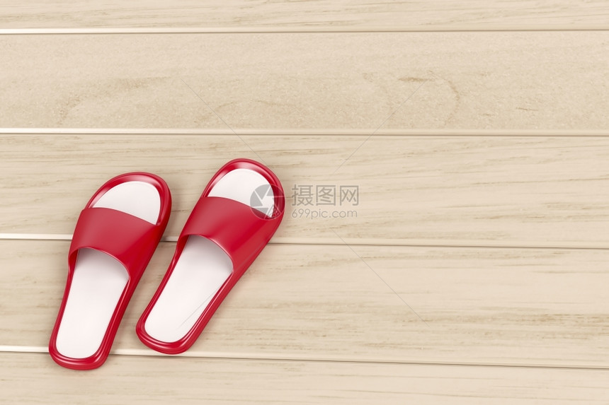 红色拖鞋木制地板上的红色拖鞋图片