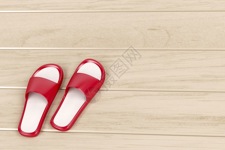 红色拖鞋木制地板上的红色拖鞋图片