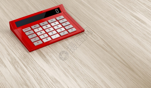 木制桌上的红色计算器背景图片
