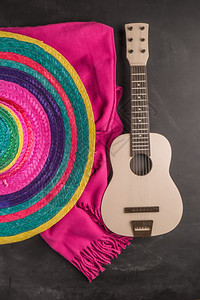 马拉色菌黑墨西哥背景薄膜吉他以及生锈的石板背景毯子带有复制空间的顶部视图背景