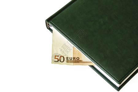 在50欧元的帐单中可以看到关闭日记的两页之间有50欧元的帐单背景图片