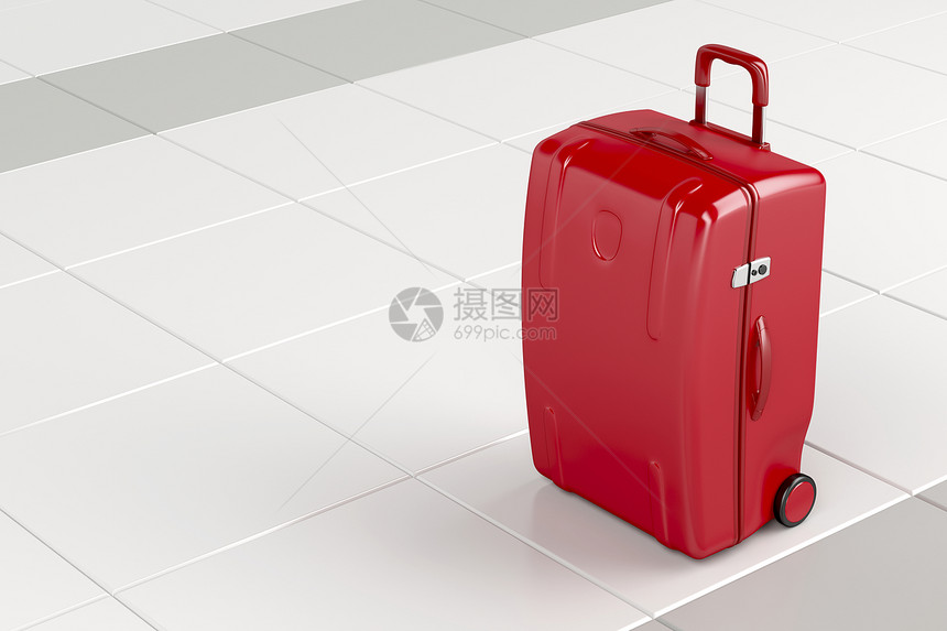 瓷砖地板上的红色旅行袋图片