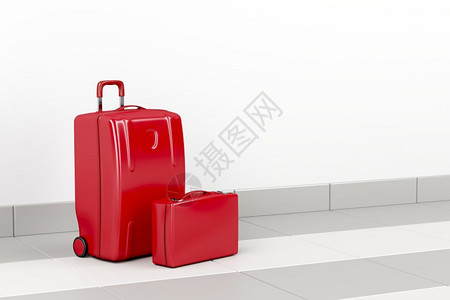 机场的红色手提箱和公事包图片
