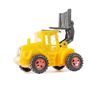 黄色载卸车由塑料制成的黄色玩具叉车装有一辆举起的载车孤立在白色背景上侧视图背景