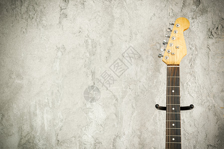 电子铅吉他特写细节旧砖墙背景音乐概念免费文本空间图片