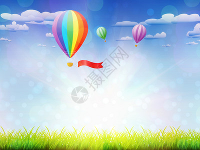 天空背景的新鲜绿草和热气球地上的热气球图片