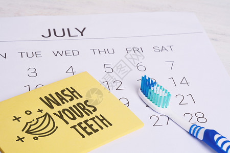 用牙刷提醒医预约日齿卫生和健康概念图片