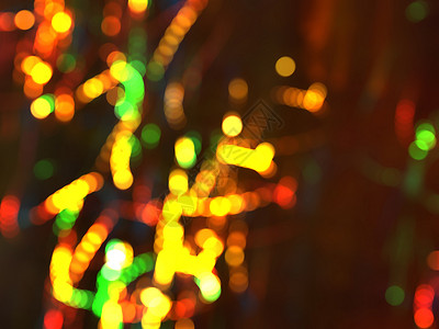 透镜光照抽象的彩色圆形布基背景夜间的圣诞灯背景