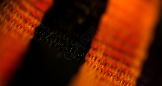 标准照片素材黑色橙带条stgeor带抽象模糊背景的宏观照片背景