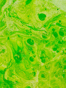 绿色水彩涂料纸面背景上的绿色丙烯涂料背景