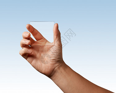 man手代表文本蓝背景位置上透明玻璃的手头代表透明玻璃的图片