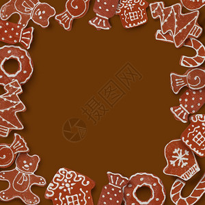 圣诞节卡片纸架由棕色背景的姜饼干制成图片