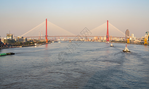 洋浦日落时向阳浦桥行驶背景