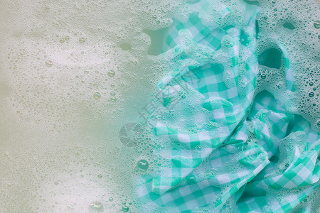 洗前泡绿白桌布背景图片