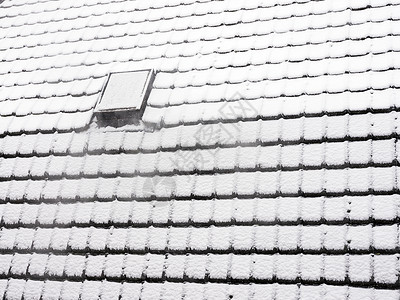 哈雪苏冬季雪盖屋顶砖块的抽象模式背景