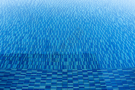 游泳池中的蓝水纹理旅行和夏季背景概念图片