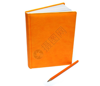 橙色铅笔白背景上的橙笔记本和铅背景
