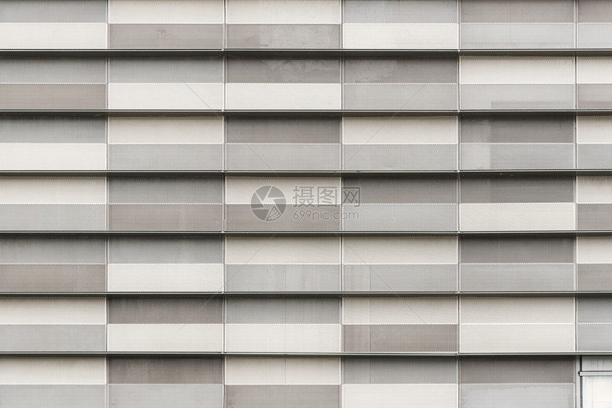 在现代建筑上装饰的灰色块抽象纹理背景图片