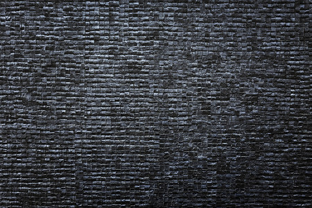 纹理黑块壁中黑砖模式的抽象背景旧背景