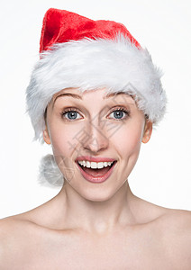 美丽的女人快乐圣诞节在塔帽白色背景的圣塔帽图片
