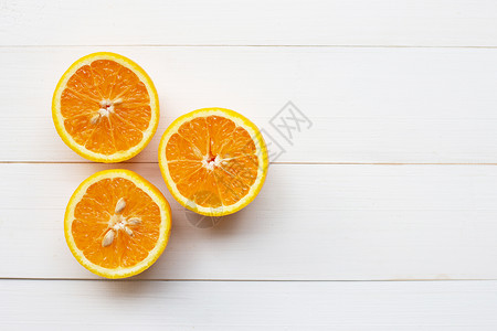白木底的橙色柑橘水果图片