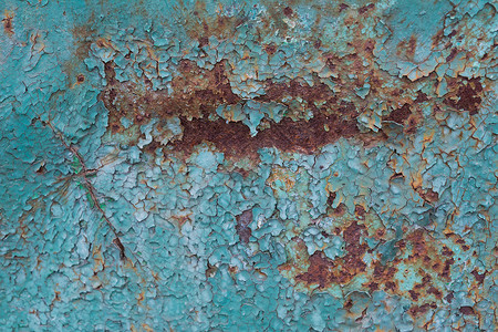 破碎的旧蓝漆和生锈金属背景覆盖艺术作品的粗体纹理模板图片
