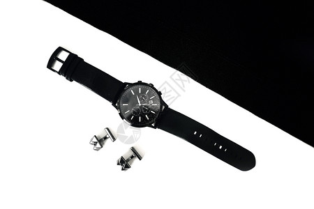 桌子上的手表和袖扣桌子上的手表和袖扣黑白图片