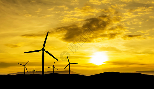 日落背景的替代型能源生产风车图片