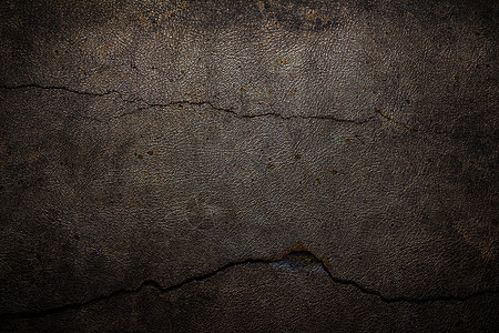 皮革碎裂的水泥背景图片
