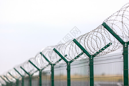 监狱栅栏带刺铁丝网的保安带刺铁丝网的敏感地点围栏带刺铁丝网的敏感地点围栏背景