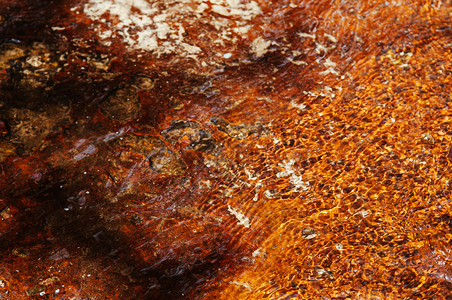 红色棕沙砂石质背景有阴影刮痕和不均匀的表面图片