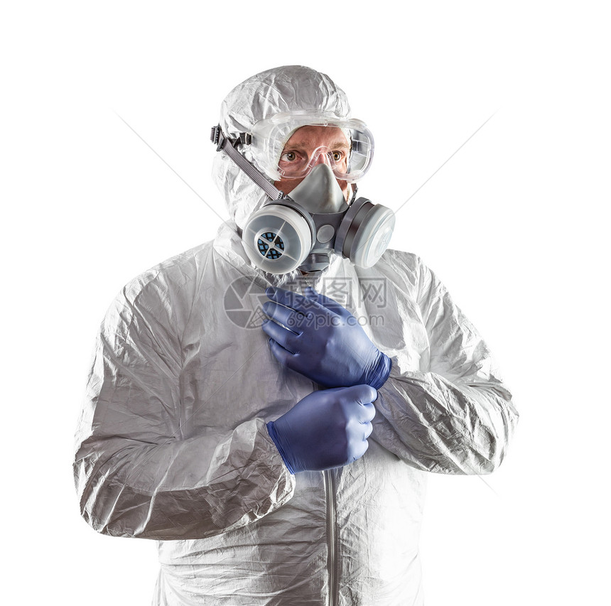 穿着哈兹马特西装护目镜和防毒面具的男子在白色上被隔离图片