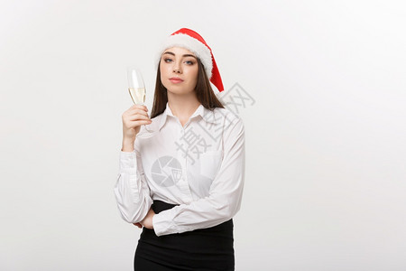 圣诞庆典年轻美丽的商业女人庆祝圣诞节香槟图片