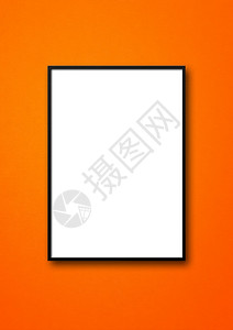 挂在橙色墙上的黑图片框空白模型板黑图片框挂在橙色墙上图片