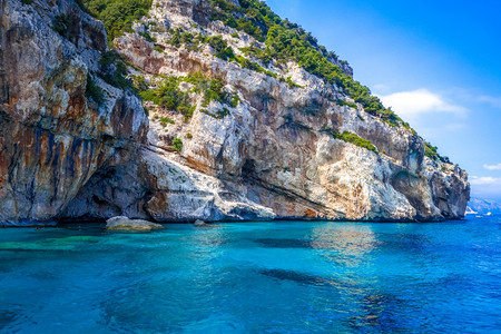 罗西尼亚卡拉马里奥卢海滩在奥罗西高尔夫撒丁岛意大利意大利撒丁岛orosei高尔夫的calamariolu海滩背景