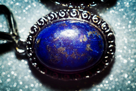 古老的银耳环天然石头蓝色拉祖利背景图片
