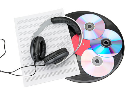 白色背景的全尺寸有线耳机乙烯唱片和cd光盘图片