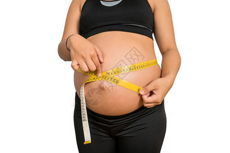 利用测量带检查婴儿发育怀孕和产概念对妇进行检查图片
