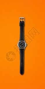 橙色背景孤立的手表橙色背景孤立的手表图片