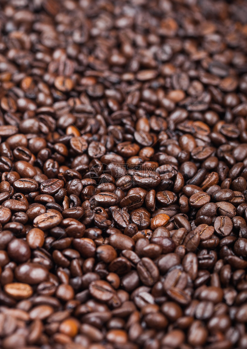 关闭新鲜生有机咖啡豆顶级视图背景宏图片