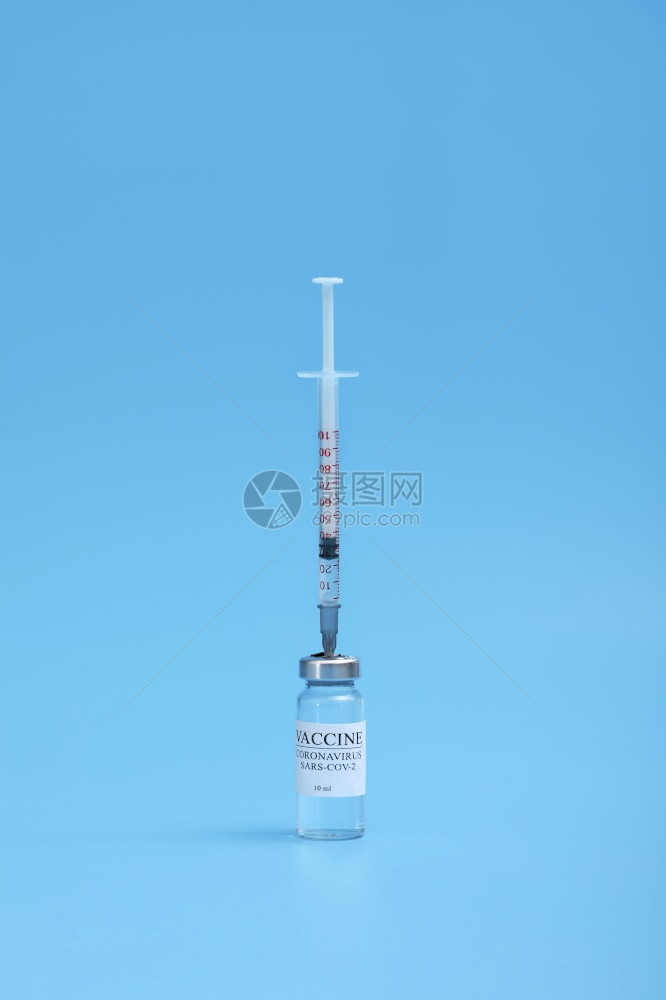 实验室医院或药房的液体疫苗蓝底的液体疫苗图片