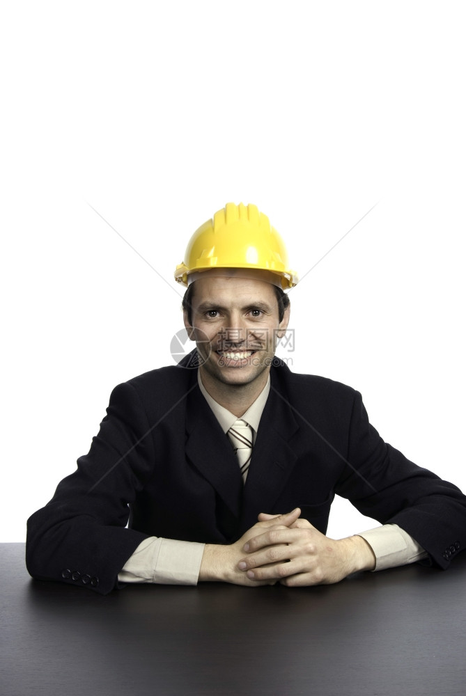 一顶黄色的工程师帽子孤立在白色上图片
